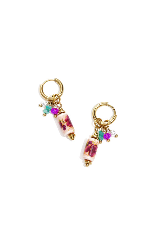 Earrings with dangling beads and a floral print