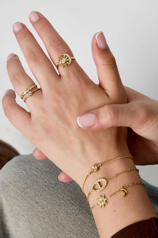 Adjustable ring with heart-shaped stone and heart